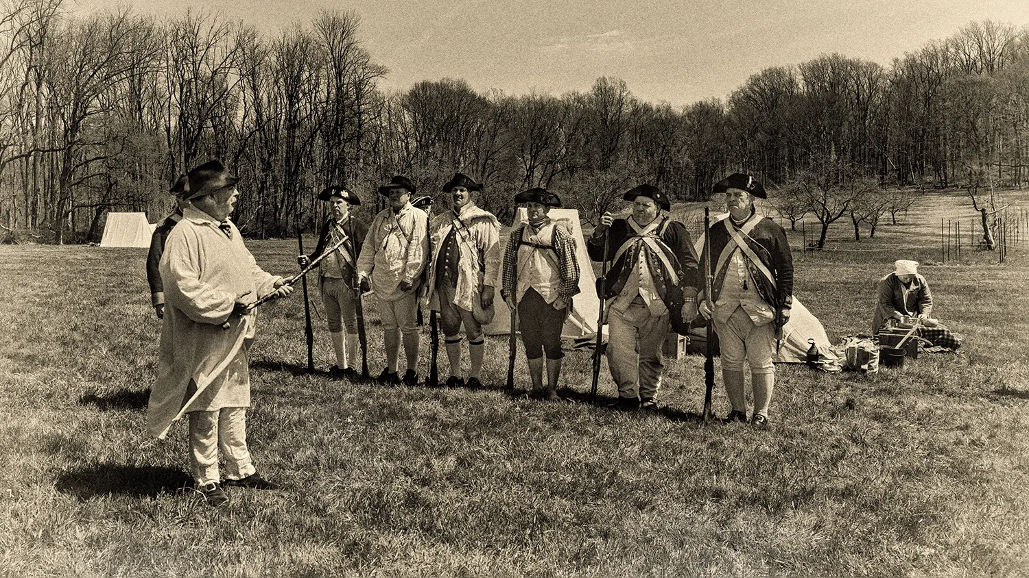 Colonial militia reenactors lined up for inspection